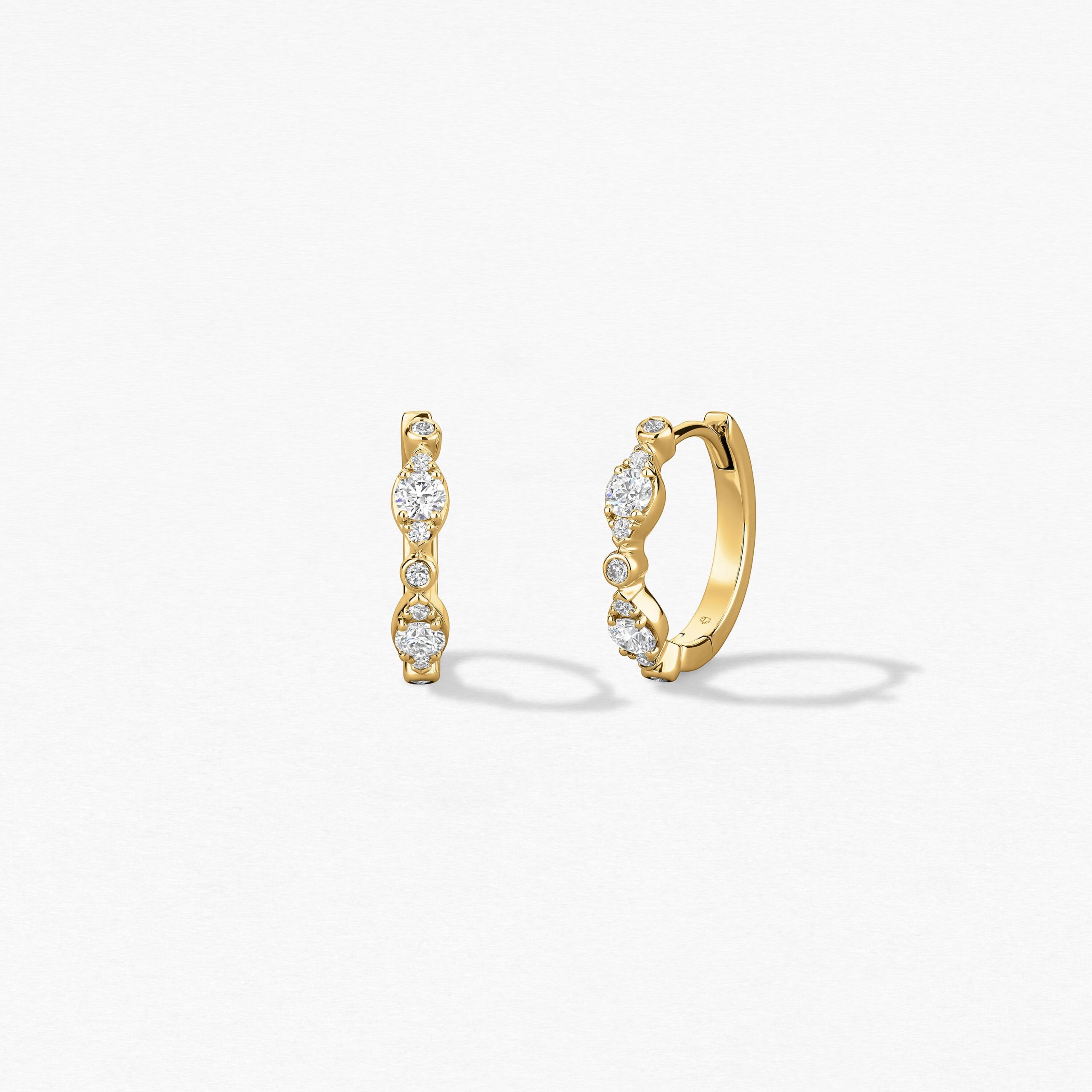 Hearts On Fire Bezel Regal Huggie